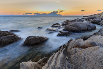 Vourvourou - Karidi beach with mount Athos in the background surprised at sunrise.
