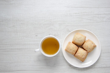 fresh homemade cookies and a cup of hot tea on a wooden table. top view . selective focus 