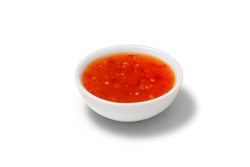 Chilli sauce in a gravy boat. White background