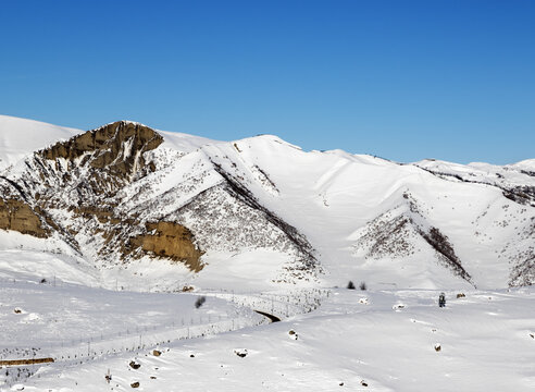 Snowy winter mountains at nice sun morning. Greater Caucasus, Mount Shahdagh. Qusar rayon of Azerbaijan.