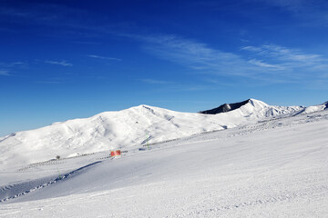 Fototapeta na wymiar Ski slope at sun day. Greater Caucasus, Mount Shahdagh. Qusar rayon of Azerbaijan.