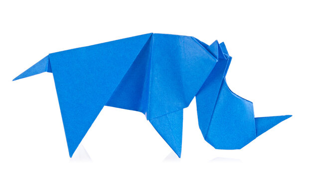 Blue rhinoceros of origami, isolated on white background.