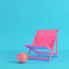 Pink beach chair with volleyball ball on bright blue background in pastel colors. Minimalism concept. 3d render