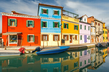 Fototapeta na wymiar The Burano island near Venice, a canal with colorful houses, Italy, Europe.