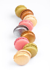 French luxury colorful macarons dessert cakes on white background with sugar on top