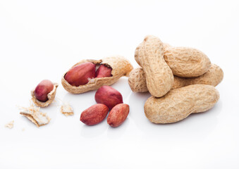 Raw peanuts with shell on white background with reflection