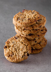 Gluten free oatmeal chocolate cookies with rasins on a stone background