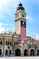 Sultan Abdul Samad Building with clock-tower and malaysian flag, Kuala Lumpur, Malaysia
