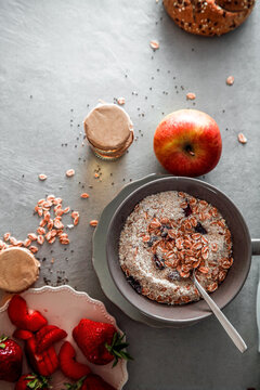Healthy breakfast variety. Cereals with fruit. Yogurt with seeds