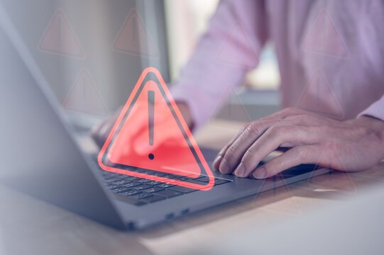 internet network security concept, man typing on computer keyboard with triangle warning sign developer with triangle caution warning sign notification error, maintenance, e-document data protection