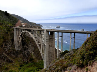 A picturesque single-span concrete bridge on the Pacific Coast Highway near Big Sur CA