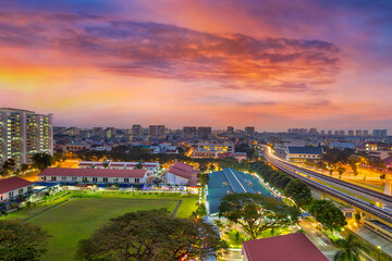 Sunrise over Eunos residential neighborhood by MRT commuter train station in Singapore