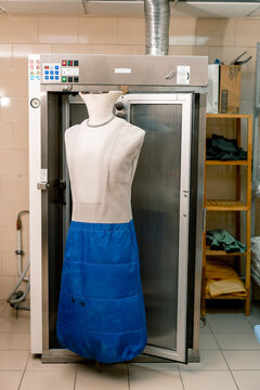ironing mannequin for clothes in an industrial hotel laundry concept of cleanliness and hospitality housekeeping