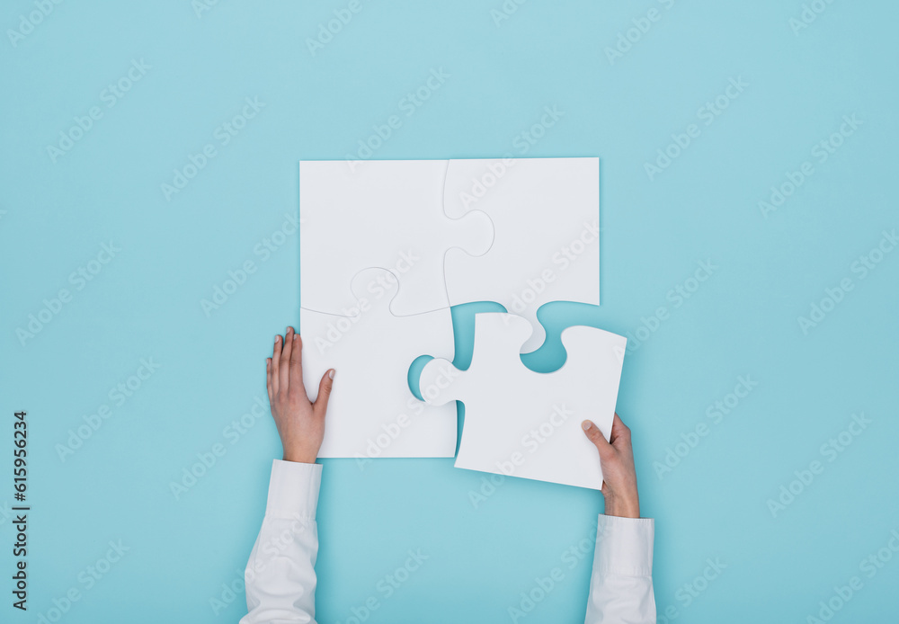 Poster woman assembling a jigsaw puzzle she is adding the last missing piece, solutions and challenges conc