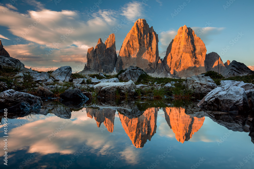 Sticker drei zinnen or tre cime di lavaredo with reflection in lake at sundown, dolomites, south tirol, ital