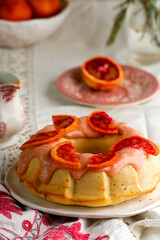 BLOOD ORANGE POUND CAKE WITH AN ORANGE ZEST ICING..vintage style.selective focus