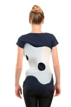 teenage patient in a corset Chenault isolated on white background. Treatment scoliosis.