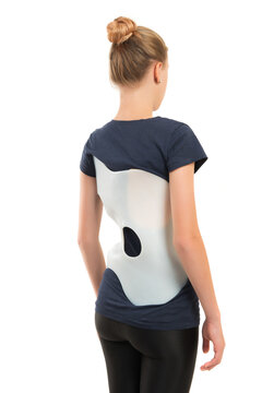 teenage patient in a corset Chenault isolated on white background. Treatment scoliosis.