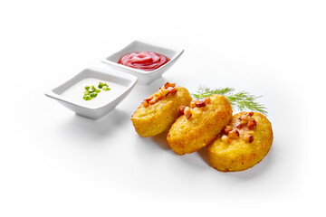 Potato dumplings - a traditional regional dish. Polish and Lithuanian cuisine. With fried bacon on a white plate.