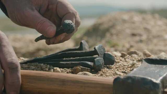 Soldier taking nails for the crucifixion of Jesus. Detailed