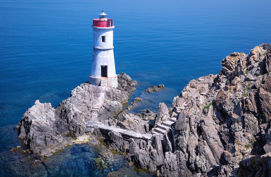 lighthouse against the blue sea