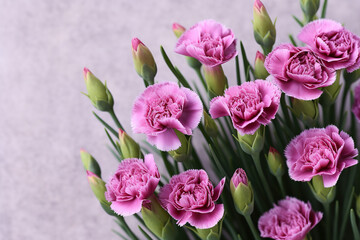 A bunch of pink carnations in a vase. Generative AI.