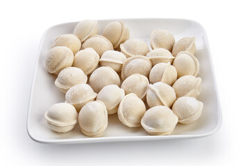 Frozen dumplings on the plate isolated on white background