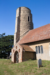 Fototapeta na wymiar All Saints Church, Ramsholt, Suffolk, England, against a blue sky