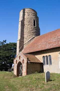 All Saints Church, Ramsholt, Suffolk, England, against a blue sky