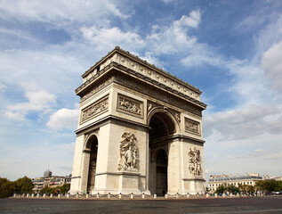 Fototapeta na wymiar Famous Arc de Triomphe in Paris without cars against a summer sky