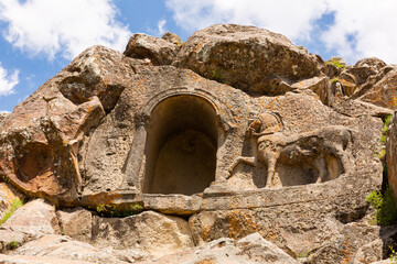 Horse relief and niche carved on steep rock located near Fasillar village, Konya, Turkey. Atlikaya - Rock of Horsman.