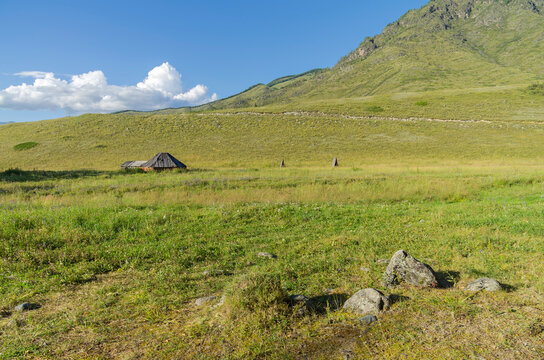 Abandoned cattle-ranch. Altai Mountains, Russia. Sunny summer day.