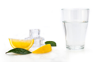 A glass beaker with crystal clear water and ice cubes. Isolated.