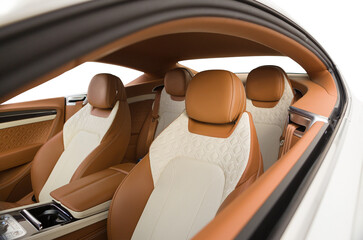 interior of a luxury sports coupe comfortable seats with milky and orange leather trim