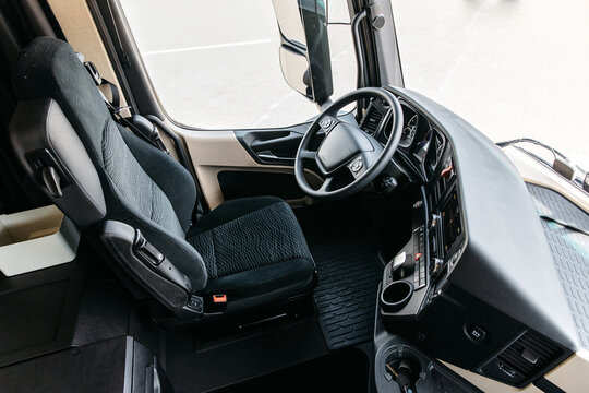 The interior of the cabin of a new modern truck. steering wheel, pedals, seat included, multimedia