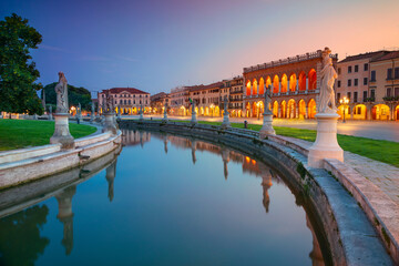Cityscape image of Padova, Italy with Prato della Valle square during sunset.