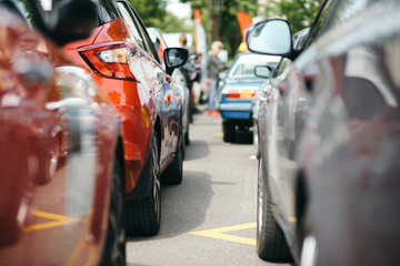 Blurred silhouettes of cars in traffic jam. Traffic jam with rows of cars on a busy street at rush hour