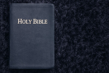 Top View of Holy Bible On Dark Texture