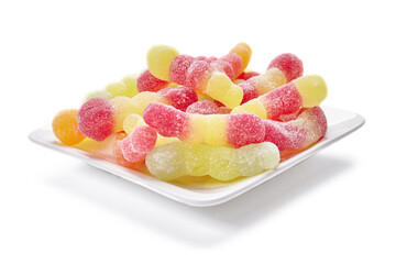 Colorful candies on the plate isolated on white background