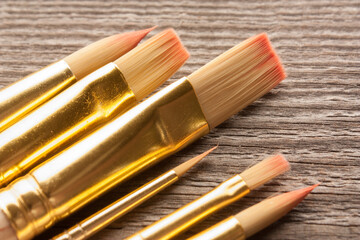 New and clean nylon brushes on wooden table.