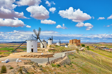 Wind mills and old castle in Consuegra, Toledo, Castilla La Mancha, Spain. Picturesque panorama...