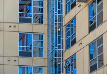 Yellow and Silver Colored Building Corner.