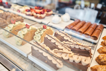 fresh pastries with berries. A variety of fresh pastries in the bakery window. almond croissant is fresh and hot in a cafe next to other types of pastries. The interior of an Italian restaurant.