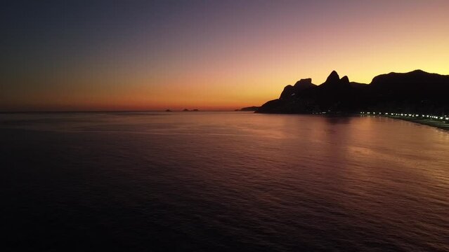Brazilian beach and mountain by the sunset