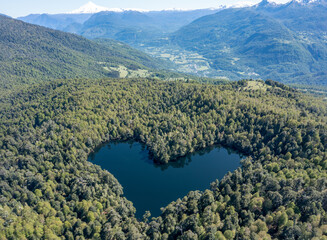 Heart lagoon, Laguna Corazon, Chile. Drone top down view go lagoon with the shape of a heart surrounded by forest, near Liquine, Region Los Lagos Chile