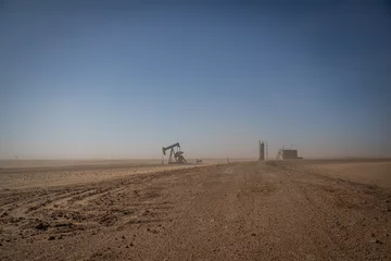 Zelfklevend Fotobehang Oil drilling in a dust storm © Alcorn Imagery