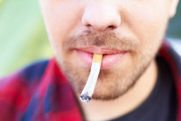 Cigarette, smoke and man with a tobacco habit and addiction due to unhealthy or bad lifestyle...