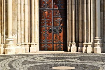Beautiful oak wood church main door or gate of the Matthias church in Budapest. black forged steel...