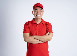 Fototapeta premium image of asian delivery man posing on white background