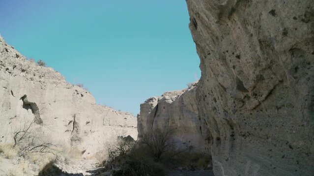 Closeup view of weathered sandstone cliffs and dry riverbed in Tuff canyon texas